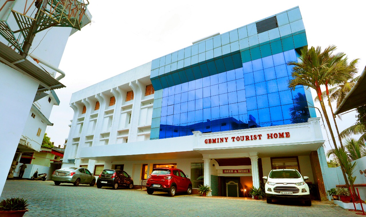 Geminy Tourist Home exterior facade, marquee, and courtyard parking in Thodupuzha